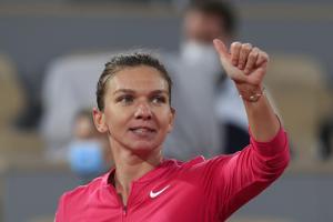 Romania's Simona Halep flashes a thumbs up after winning her third round match of the French Open tennis tournament against Amanda Anisimova of the U.S. in two sets, 6-0, 6-1, at the Roland Garros stadium in Paris, France, Friday, Oct. 2, 2020.(AP) Romania's Simona Halep flashes a thumbs up after winning her third round match of the French Open tennis tournament against Amanda Anisimova of the U.S. in two sets, 6-0, 6-1, at the Roland Garros stadium in Paris, France, Friday, Oct. 2, 2020.(AP)