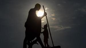 A worker cleans Mahatama Gandhi statue on the eve of his birth anniversary at Marina beach in Chennai on Thursday.(PTI Photo) A worker cleans Mahatama Gandhi statue on the eve of his birth anniversary at Marina beach in Chennai on Thursday.(PTI Photo)