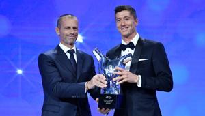 Bayern Munich's Robert Lewandowski after winning the Player of the year with UEFA President Aleksander Ceferin.(REUTERS) Bayern Munich's Robert Lewandowski after winning the Player of the year with UEFA President Aleksander Ceferin.(REUTERS)