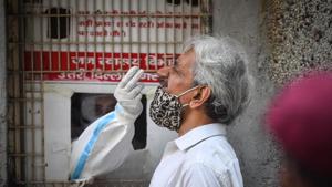 A health worker collects a swab sample for coronavirus testing, at Rajendra Nagar in New Delhi.(Sanchit Khanna/ Hindustan Times) A health worker collects a swab sample for coronavirus testing, at Rajendra Nagar in New Delhi.(Sanchit Khanna/ Hindustan Times)