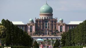 A woman wearing a protective mask walks past Malaysia's Prime Minister's office, amid the coronavirus disease (Covid-19) outbreak in Putrajaya, Malaysia.(REUTERS) A woman wearing a protective mask walks past Malaysia's Prime Minister's office, amid the coronavirus disease (Covid-19) outbreak in Putrajaya, Malaysia.(REUTERS)