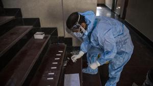 A Kashmiri health worker collects samples to test for Covid-19 in Srinagar.(AP) A Kashmiri health worker collects samples to test for Covid-19 in Srinagar.(AP)