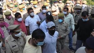 The men charged under UAPA being taken away by Uttar Pradesh Police. (HT Photo) The men charged under UAPA being taken away by Uttar Pradesh Police. (HT Photo)