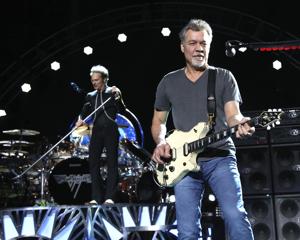 Eddie Van Halen of Van Halen perform on Aug. 13, 2015, in Wantagh, N.Y. Van Halen, who had battled mouth cancer, died Tuesday, Oct. 6, 2020. He was 65.(Greg Allen/Invision/AP) Eddie Van Halen of Van Halen perform on Aug. 13, 2015, in Wantagh, N.Y. Van Halen, who had battled mouth cancer, died Tuesday, Oct. 6, 2020. He was 65.(Greg Allen/Invision/AP)