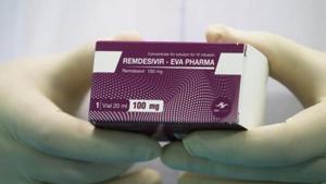 A lab technicians holds the coronavirus disease (Covid-19) treatment drug A lab technicians holds the coronavirus disease (Covid-19) treatment drug