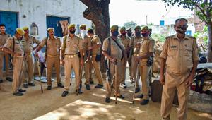 Police personnel stand guard outside the residence of a 19-year-old Dalit woman who died after being allegedly gang-raped, at Bulgadi village in Hathras, Tuesday, Oct. 6, 2020.(PTI photo) Police personnel stand guard outside the residence of a 19-year-old Dalit woman who died after being allegedly gang-raped, at Bulgadi village in Hathras, Tuesday, Oct. 6, 2020.(PTI photo)