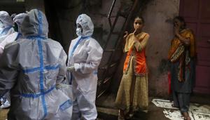 Health workers screen residents for Covid-19 symptoms at Dharavi, one of Asia's largest slums, in Mumbai, India.(AP photo) Health workers screen residents for Covid-19 symptoms at Dharavi, one of Asia's largest slums, in Mumbai, India.(AP photo)