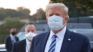 US President Donald Trump looks over at reporters and photographers as the president departs Walter Reed National Military Medical Center after a fourth day of treatment for the coronavirus disease to return to the White House in Washington from the hospital in Bethesda.(REUTERS) US President Donald Trump looks over at reporters and photographers as the president departs Walter Reed National Military Medical Center after a fourth day of treatment for the coronavirus disease to return to the White House in Washington from the hospital in Bethesda.(REUTERS)