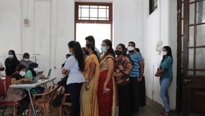 Employees of Colombo municipal council wait to give their swab samples to test for COVID-19 in Colombo, Sri Lanka, Wednesday, Oct. 7, 2020. Authorities in Sri Lanka on Wednesday widened a curfew and warned of legal action against those evading treatment for COVID-19 after reporting an escalating cluster centered around a garment factory in the capital's suburbs. (AP Photo/Eranga Jayawardena)(AP) Employees of Colombo municipal council wait to give their swab samples to test for COVID-19 in Colombo, Sri Lanka, Wednesday, Oct. 7, 2020. Authorities in Sri Lanka on Wednesday widened a curfew and warned of legal action against those evading treatment for COVID-19 after reporting an escalating cluster centered around a garment factory in the capital's suburbs. (AP Photo/Eranga Jayawardena)(AP)