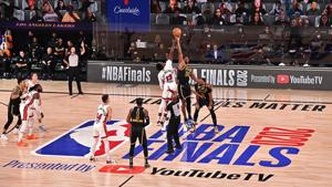 Bam Adebayo of the Miami Heat and Dwight Howard of the Los Angeles Lakers go up for the opening tip off.(Getty Images) Bam Adebayo of the Miami Heat and Dwight Howard of the Los Angeles Lakers go up for the opening tip off.(Getty Images)