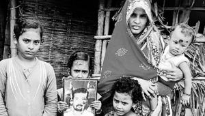 From left: Daughters Sonali, Rupali (holding Prafulla Behera’s photo), Asha, and wife Rita, carrying Payal, who turns one next month. From left: Daughters Sonali, Rupali (holding Prafulla Behera’s photo), Asha, and wife Rita, carrying Payal, who turns one next month.