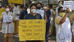 Medical workers show banners during protest to demanding their unpaid salary of four months, outside Hindu Rao Hospital, at Malka Ganj in New Delhi on Wednesday, October, 2020.(Biplov Bhuyan/HT PHOTO) Medical workers show banners during protest to demanding their unpaid salary of four months, outside Hindu Rao Hospital, at Malka Ganj in New Delhi on Wednesday, October, 2020.(Biplov Bhuyan/HT PHOTO)