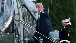 US President Donald Trump boards Marine One as he departs Walter Reed National Military Medical Center after a fourth day of treatment for the coronavirus disease to return to the White House in Washington from the hospital in Bethesda, Maryland.(REUTERS) US President Donald Trump boards Marine One as he departs Walter Reed National Military Medical Center after a fourth day of treatment for the coronavirus disease to return to the White House in Washington from the hospital in Bethesda, Maryland.(REUTERS)
