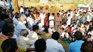 Rajasthan: People sitting on a protest after the death of a priest in Karauli.(ANI) Rajasthan: People sitting on a protest after the death of a priest in Karauli.(ANI)
