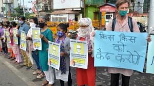 Social activists hold placards during a protest after National Investigation Agency (NIA) arrested 82-year-old Father Stan Swamy on Thursday evening, for his alleged involvement in Bhima Koregaon violence, in Ranchi.(PTI)