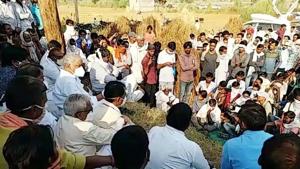 Rajasthan: People sitting on a protest after the death of a priest in Karauli.(ANI) Rajasthan: People sitting on a protest after the death of a priest in Karauli.(ANI)