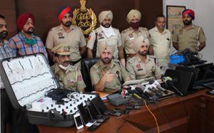 Mobile phones and other items seized during police raids at Homeland Heights in Mohali.(Gurminder Singh/HT) Mobile phones and other items seized during police raids at Homeland Heights in Mohali.(Gurminder Singh/HT)