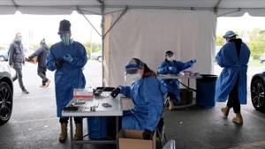 Personnel administer coronavirus disease (Covid-19) tests in Milwaukee, Wisconsin, US.(Reuters) Personnel administer coronavirus disease (Covid-19) tests in Milwaukee, Wisconsin, US.(Reuters)