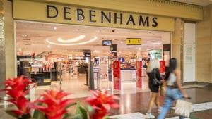 Pedestrians walk past the Debenhams Plc department store at the Trafford Centre shopping mall, operated by Intu Properties Plc, in Manchester, UK.(Bloomberg) Pedestrians walk past the Debenhams Plc department store at the Trafford Centre shopping mall, operated by Intu Properties Plc, in Manchester, UK.(Bloomberg)