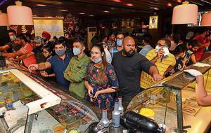 Residents at an ice-cream parlour on Malhar road in Ludhiana on Monday. Residents at an ice-cream parlour on Malhar road in Ludhiana on Monday.