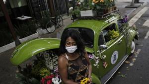 Valcineia Machado, also known as Roberta, poses by her car which she transformed to a mobile flower shop after loosing her business amid the coronavirus disease (COVID-19) outbreak, in Rio de Janeiro, Brazil.(REUTERS) Valcineia Machado, also known as Roberta, poses by her car which she transformed to a mobile flower shop after loosing her business amid the coronavirus disease (COVID-19) outbreak, in Rio de Janeiro, Brazil.(REUTERS)
