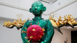 Displayed at the art exhibition held at the Vincom Centre for Contemporary Art in Hanoi, Vietnam, Pham Thai Binh’s “Land Genie” serves a stark contrast to the bleak ongoing pandemic. It showcases small figures occupied in various activities during the pandemic. Visitors gather around the sculpture to observe the work of art and get pictures clicked . (Reuters) Displayed at the art exhibition held at the Vincom Centre for Contemporary Art in Hanoi, Vietnam, Pham Thai Binh’s “Land Genie” serves a stark contrast to the bleak ongoing pandemic. It showcases small figures occupied in various activities during the pandemic. Visitors gather around the sculpture to observe the work of art and get pictures clicked . (Reuters)