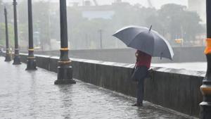 File photo: People deal with rain at Gateway of India at Colaba in Mumbai.(Satish Bate/HT PHOTO) File photo: People deal with rain at Gateway of India at Colaba in Mumbai.(Satish Bate/HT PHOTO)