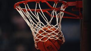 Generic view of a Spalding NBA basketball dropping into the hoop during the FIBA European Basketball Championship.(Getty Images) Generic view of a Spalding NBA basketball dropping into the hoop during the FIBA European Basketball Championship.(Getty Images)