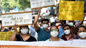 Resident doctors of civic-run Hindu Rao Hospital hold placards during a protest against unpaid dues or salaries, at Hindu Rao Hospital in New Delhi on Monday. (ANI Photo) Resident doctors of civic-run Hindu Rao Hospital hold placards during a protest against unpaid dues or salaries, at Hindu Rao Hospital in New Delhi on Monday. (ANI Photo)