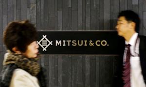 People walk past the logo of Japanese trading company Mitsui & Co in Tokyo, Japan in this file photo.(Reuters Photo) People walk past the logo of Japanese trading company Mitsui & Co in Tokyo, Japan in this file photo.(Reuters Photo)