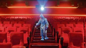 A worker sanities inside a theatre hall ahead of the scheduled reopening of cinema theatres on October 15 as the Covid-19 coronavirus imposed lockdown eases further in Mumbai on October 13, 2020.(AFP) A worker sanities inside a theatre hall ahead of the scheduled reopening of cinema theatres on October 15 as the Covid-19 coronavirus imposed lockdown eases further in Mumbai on October 13, 2020.(AFP)