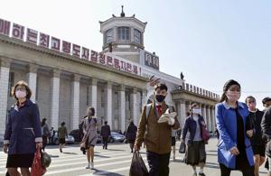 People wearing protective face masks walk amid concerns over the Covid-19 in front of Pyongyang Station in Pyongyang(REUTERS) People wearing protective face masks walk amid concerns over the Covid-19 in front of Pyongyang Station in Pyongyang(REUTERS)