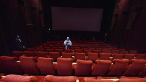 A worker chemically disinfects a cinema hall at PVR ICON during a press preview of preparedness for reopening halls amid the Covid-19 pandemic, at DLF Promenade Mall, Vasant Kunj, in New Delhi on October 14, 2020.(Sanjeev Verma/HT Photo) A worker chemically disinfects a cinema hall at PVR ICON during a press preview of preparedness for reopening halls amid the Covid-19 pandemic, at DLF Promenade Mall, Vasant Kunj, in New Delhi on October 14, 2020.(Sanjeev Verma/HT Photo)