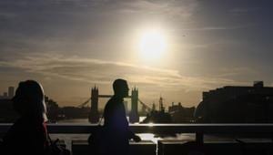 Commuters cross London Bridge in view of Tower Bridge in London on October 15.(Bloomberg) Commuters cross London Bridge in view of Tower Bridge in London on October 15.(Bloomberg)