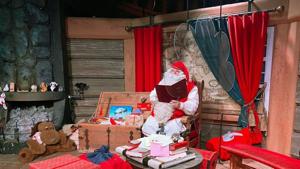 Santa Claus is pictured in his chamber behind a plexiglas screen at Santa Claus Village in the Arctic Circle near Rovaniemi, Finland.(REUTERS) Santa Claus is pictured in his chamber behind a plexiglas screen at Santa Claus Village in the Arctic Circle near Rovaniemi, Finland.(REUTERS)