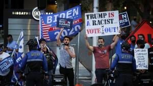 Supporters of Democratic US presidential nominee Joe Biden gather outside Perez Art Museum before the arrival of US President Donald Trump for a town hall in Miami, Florida.(REUTERS) Supporters of Democratic US presidential nominee Joe Biden gather outside Perez Art Museum before the arrival of US President Donald Trump for a town hall in Miami, Florida.(REUTERS)