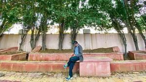 A gentleman, sitting on one of the nearby benches, is found insulting the area’s charm by gazing exclusively at his mobile phone screen. A gentleman, sitting on one of the nearby benches, is found insulting the area’s charm by gazing exclusively at his mobile phone screen.