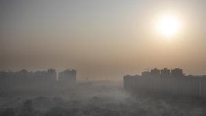 Morning haze envelops the skyline on the outskirts of New Delhi on Friday.(AP) Morning haze envelops the skyline on the outskirts of New Delhi on Friday.(AP)