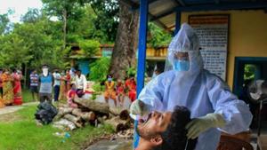 A health worker collects swab sample of a villager for Covid-19 test in Manipur.(PTI) A health worker collects swab sample of a villager for Covid-19 test in Manipur.(PTI)