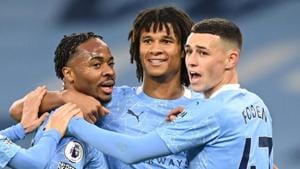 Manchester City's Raheem Sterling celebrates scoring their first goal with Phil Foden and Nathan Ake.(Pool via REUTERS) Manchester City's Raheem Sterling celebrates scoring their first goal with Phil Foden and Nathan Ake.(Pool via REUTERS)