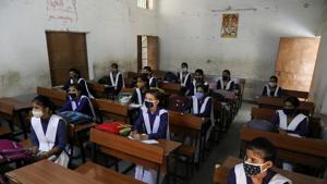 Students wearing protective face masks are seen inside a classroom of a government-run school after authorities ordered schools to reopen voluntarily for classes 9 to 12, amidst the coronavirus disease outbreak.(Reuters) Students wearing protective face masks are seen inside a classroom of a government-run school after authorities ordered schools to reopen voluntarily for classes 9 to 12, amidst the coronavirus disease outbreak.(Reuters)