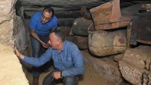 This undated photo provided by the Egyptian Ministry of Tourism and Antiquities, Egyptian Prime Minister Mustafa Madbouly, left and Mostafa Waziri, Secretary General of the Supreme Council of Antiquities inspects a trove of ancient coffins and artifacts that Egyptian archaeologists recently unearthed in a vast necropolis south of Cairo, authorities announced Monday, Oct. 19, 2020, in Saqqara, south of Cairo, Egypt.(AP photo)