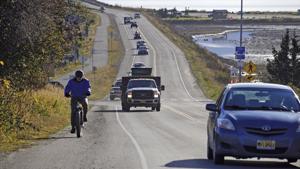 A biker leads a line of cars driving off the Homer Spit at about on October 19, 2020, in Homer, Alaska after a tsunami evacuation order was issued for low-lying areas in Homer.(AP Photo) A biker leads a line of cars driving off the Homer Spit at about on October 19, 2020, in Homer, Alaska after a tsunami evacuation order was issued for low-lying areas in Homer.(AP Photo)