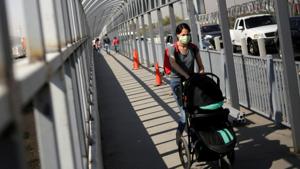 A woman walks across the Zaragoza-Ysleta border bridge crossing towards El Paso, Texas, US, as Mexico's Department of Foreign Relations requested another month-long extension on land-crossing restrictions at the US-Mexico border due to the coronavirus disease (Covid-19) outbreak.(Reuters Photo) A woman walks across the Zaragoza-Ysleta border bridge crossing towards El Paso, Texas, US, as Mexico's Department of Foreign Relations requested another month-long extension on land-crossing restrictions at the US-Mexico border due to the coronavirus disease (Covid-19) outbreak.(Reuters Photo)
