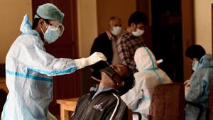 A health worker collects a nasal swab from a man for a Covid-19 test in Srinagar.(ANI) A health worker collects a nasal swab from a man for a Covid-19 test in Srinagar.(ANI)