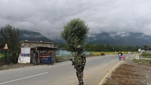A paramilitary soldier stands guard on the Srinagar- Ladakh Highway. (HT Photo) A paramilitary soldier stands guard on the Srinagar- Ladakh Highway. (HT Photo)