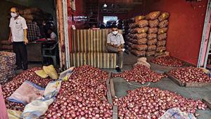 Traders at the APMC Onion Potato Market in Navi Mumbai on Friday. Traders at the APMC Onion Potato Market in Navi Mumbai on Friday.
