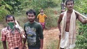 Anant Beria and his father Baisakhu Beria were busy digging a canal under the rural jobs guarantee scheme in Odisha.(HT Photo) Anant Beria and his father Baisakhu Beria were busy digging a canal under the rural jobs guarantee scheme in Odisha.(HT Photo)
