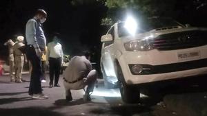 Police officials look for clues at the spot where Gurlal Brar, an aide of gangster Lawrence Bishnoi was shot dead in the early hours of October 11 in Chandigarh.(HT Photo) Police officials look for clues at the spot where Gurlal Brar, an aide of gangster Lawrence Bishnoi was shot dead in the early hours of October 11 in Chandigarh.(HT Photo)