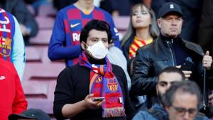 FILE PHOTO: Soccer Football - La Liga Santander - FC Barcelona v Real Sociedad - Camp Nou, Barcelona, Spain - March 7, 2020 A Barcelona fan wears a mask before the match due to the recent coronavirus outbreak REUTERS/Albert Gea/File Photo(REUTERS) FILE PHOTO: Soccer Football - La Liga Santander - FC Barcelona v Real Sociedad - Camp Nou, Barcelona, Spain - March 7, 2020 A Barcelona fan wears a mask before the match due to the recent coronavirus outbreak REUTERS/Albert Gea/File Photo(REUTERS)